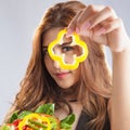 Young woman brunette present and eating salad Royalty Free Stock Photo