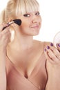 A young woman with brush and mirror Royalty Free Stock Photo