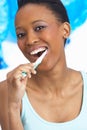 Young Woman Brushing Teeth In Studio Royalty Free Stock Photo