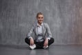 Young woman in business suit sitting in Lotus pose, restore energy, meditate. Royalty Free Stock Photo