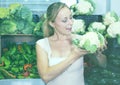 Young woman buying cabbage at market Royalty Free Stock Photo