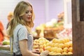 Young woman buying groceries on the fruit market Royalty Free Stock Photo