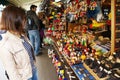 Young woman buying souvenirs in gift shop