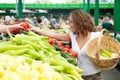 Young Woman Buying Tomato at Grocery Market Royalty Free Stock Photo