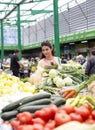 Young woman buying vegetables on the market Royalty Free Stock Photo