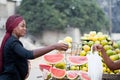 Young woman buys fruit at the street market. Royalty Free Stock Photo