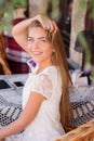 Young woman in caffee looking aside