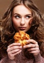 Young woman with a cake close up