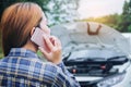 Young Woman calling for assistance with his car broken down by t Royalty Free Stock Photo