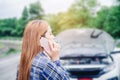 Young Woman calling for assistance with his car broken down by t Royalty Free Stock Photo