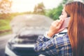 Young Woman calling for assistance with his car broken down by t Royalty Free Stock Photo