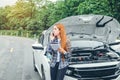 Young Woman calling for assistance with his car broken down by t Royalty Free Stock Photo