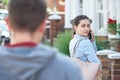 Young Woman Calling For Help On Mobile Phone Whilst Being Stalke