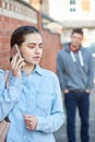 Young Woman Calling For Help On Mobile Phone Whilst Being Stalke