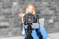 Young woman on camera LCD screen waving Royalty Free Stock Photo