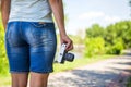 Young woman with camera outdoors . Soft sunny colors. woman with vintage retro camera Royalty Free Stock Photo