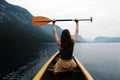 Young woman canoeing in the lake bohinj on a summer day Royalty Free Stock Photo