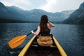 Young woman canoeing in the lake bohinj on a summer day Royalty Free Stock Photo