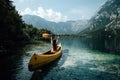 Young woman canoeing in the lake bohinj on a summer day Royalty Free Stock Photo