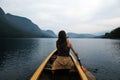 Young woman canoeing in the lake bohinj on a summer day Royalty Free Stock Photo