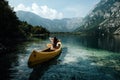 Young woman canoeing in the lake bohinj on a summer day Royalty Free Stock Photo