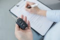 Young Woman in a Car Rental Service Assistant Concept Royalty Free Stock Photo