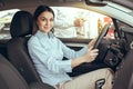 Young Woman in a Car Rental Service Test Drive Concept Royalty Free Stock Photo