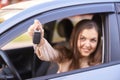 Young woman in car. Ride instruction. Automobile loan. Hand with key Royalty Free Stock Photo