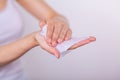 Woman carefuly cleaning hands with wet wipes