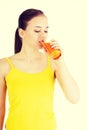 Young woman with the carrots juice Royalty Free Stock Photo