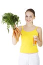 Young woman with the carrots juice Royalty Free Stock Photo