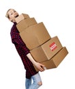 Young woman carrying stack of heavy cardboard boxes isolated on white Royalty Free Stock Photo