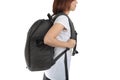 Young woman carrying with travel backpack isolated white background. Royalty Free Stock Photo