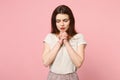 Young woman in casual light clothes posing  on pastel pink wall background studio portrait. People sincere Royalty Free Stock Photo