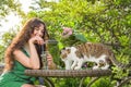 Young woman with cat at backyard Royalty Free Stock Photo