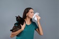 Young woman with cat suffering from allergy Royalty Free Stock Photo