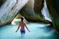 Young woman at cave on tropical beach Royalty Free Stock Photo