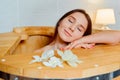 Young woman in cedar barrel. Spa ,medical procedures, skin care and treatment. Sauna and Hammam Royalty Free Stock Photo