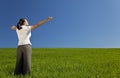 Young Woman Celebrating In A Green Field