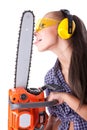 Young woman with a chainsaw