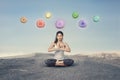 Young woman with chakra symbols during outdoor yoga meditation Royalty Free Stock Photo