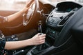 Young woman changing gears in car. Driving a car. Royalty Free Stock Photo