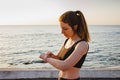 Young woman checking her heart rate at fitness tracker. Royalty Free Stock Photo