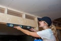 Kitchen Remodel Young Woman with Level Side Royalty Free Stock Photo