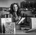 Young woman checking list of christmas presents Royalty Free Stock Photo