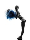 Young woman cheerleader cheerleading silhouette Royalty Free Stock Photo