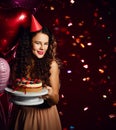 Young woman chef cook holding sweet cake with strawberry blueberry and cream smiling Royalty Free Stock Photo