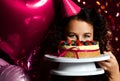 Young woman chef cook holding sweet cake with strawberry blueberry and cream smiling Royalty Free Stock Photo