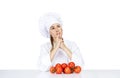 Young woman chef showing tomatos for italian food on white Royalty Free Stock Photo