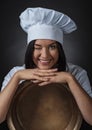 Young woman with big brass pan. Royalty Free Stock Photo